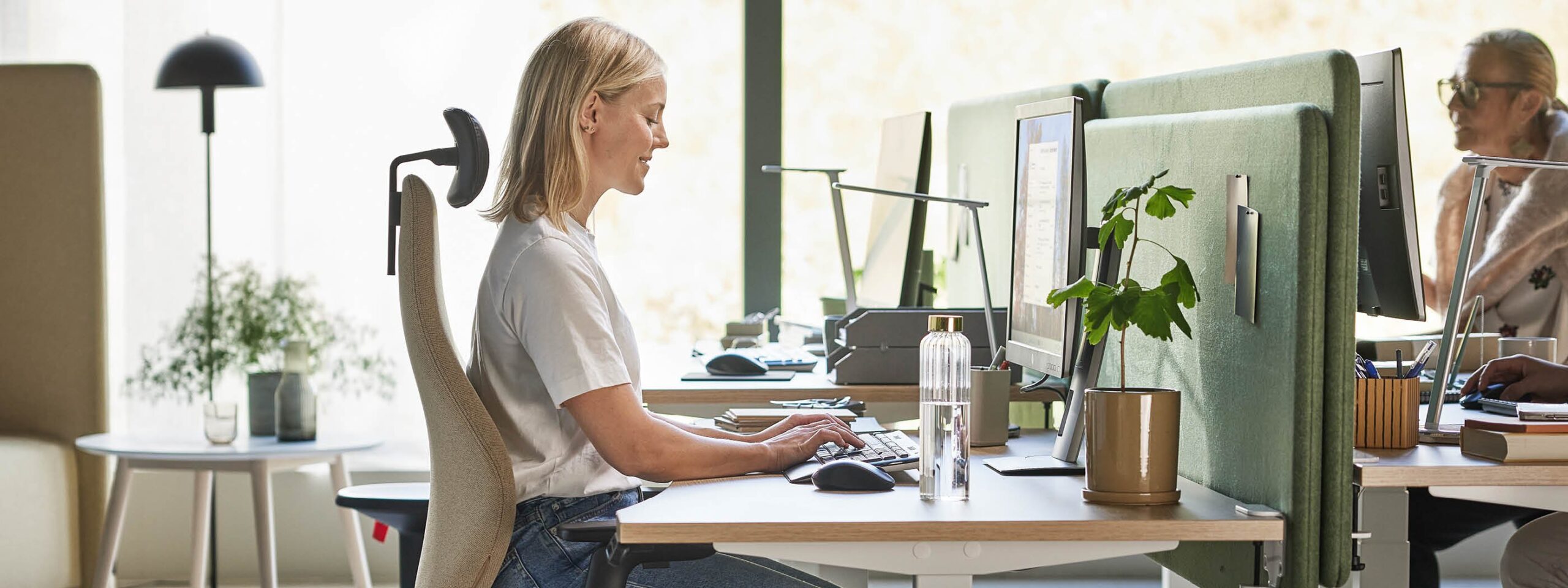 Woman with an ergonomic desk setup