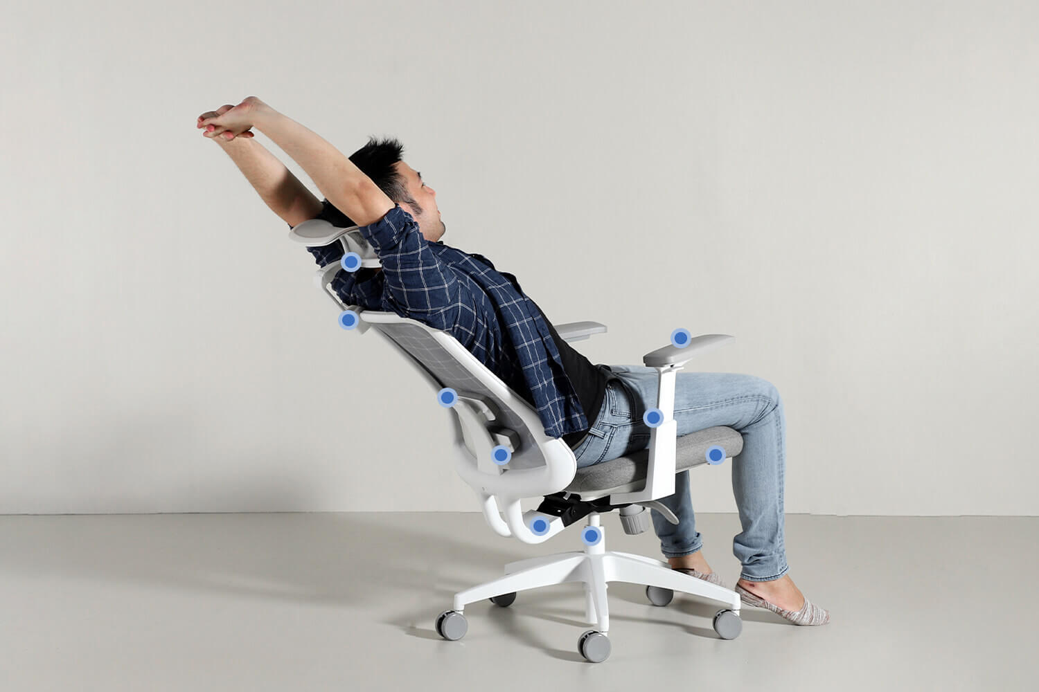 man stretching on an ergonomic chair