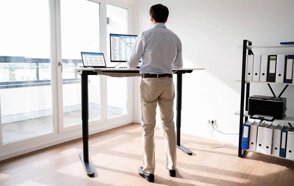Man standing at work to do some spreadsheets