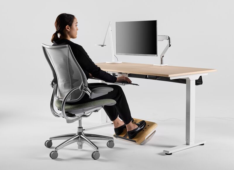 Woman sitting on chair at desk