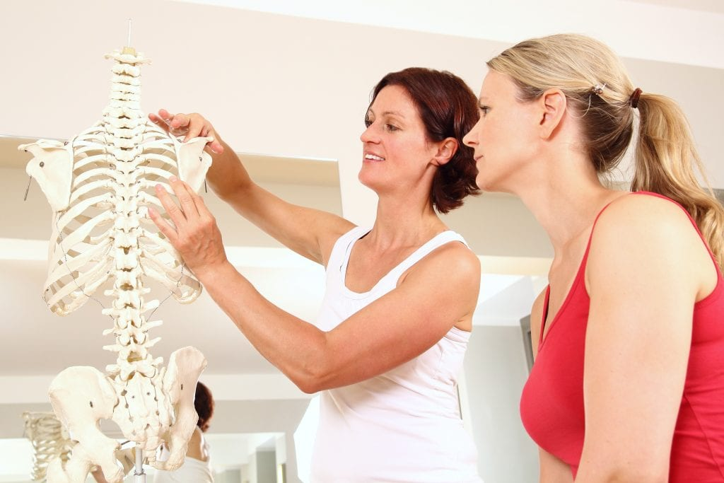 Two women looking at a skeleton