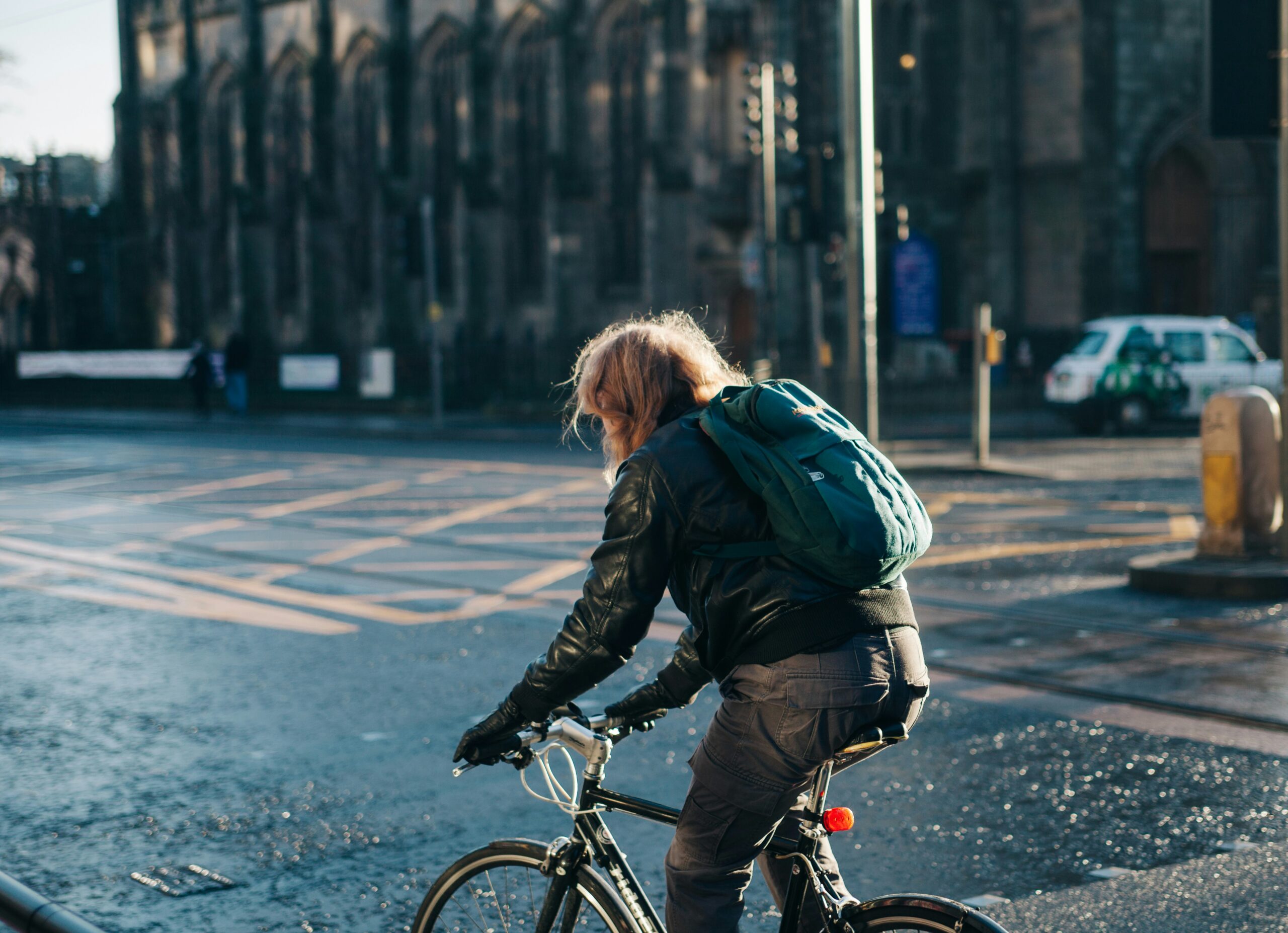 A person actively communicating to work by bike