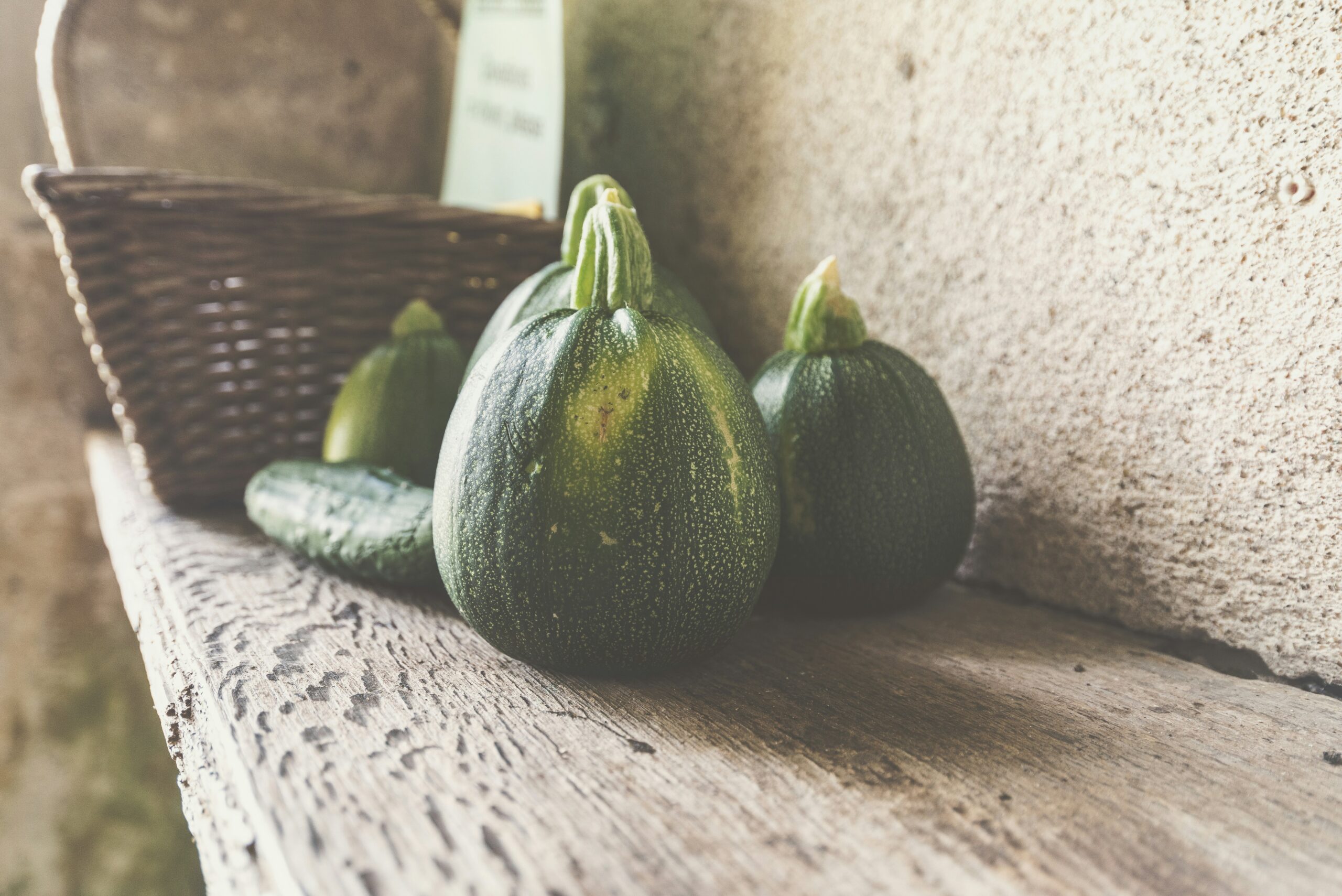 Some pumpkins on a shelf