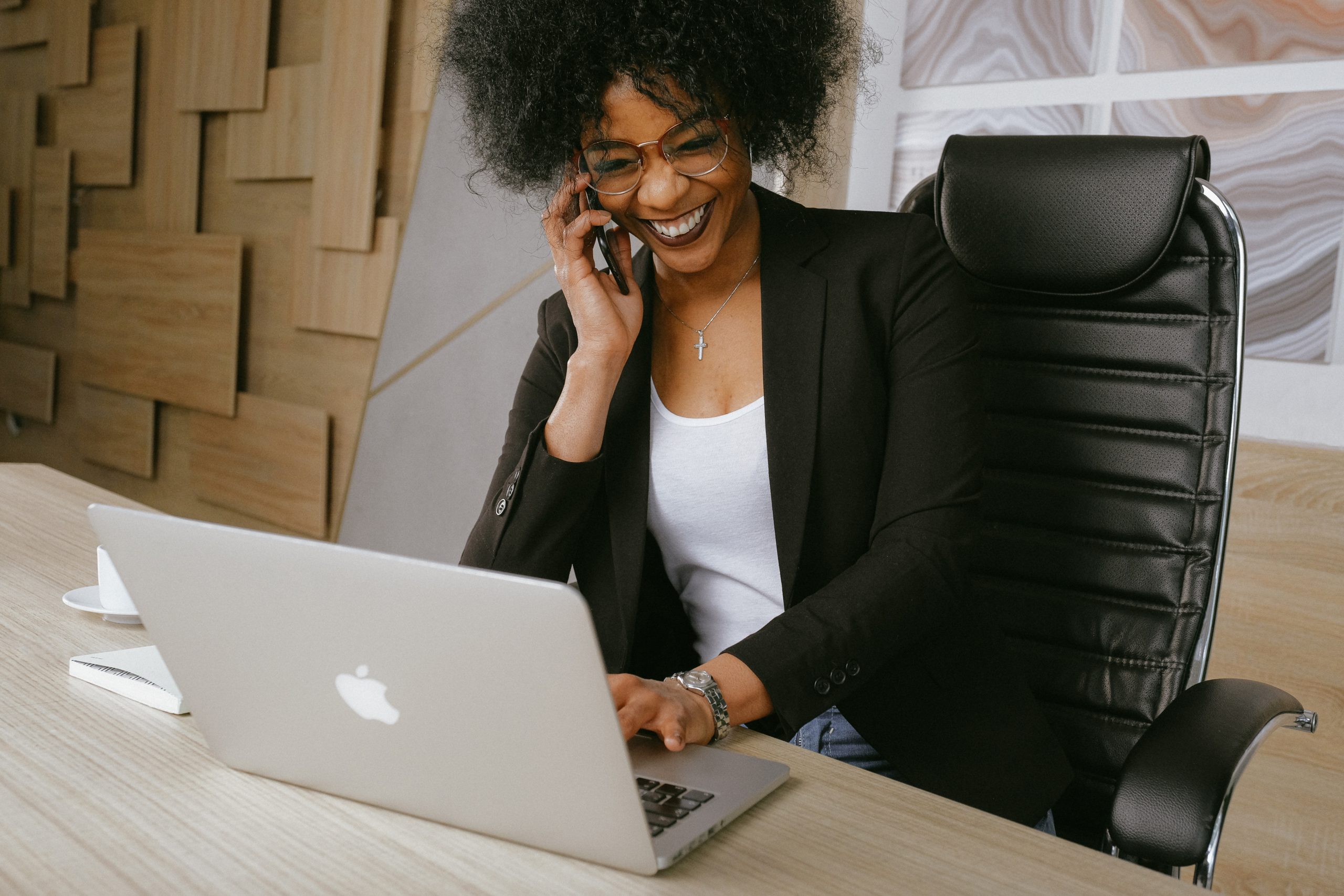 a woman using an ergonomic chair at work