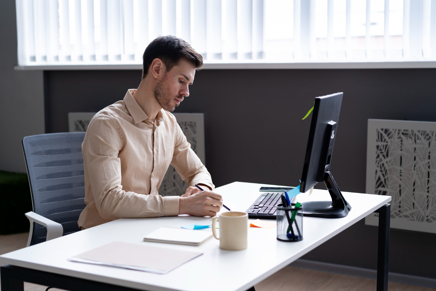 Happy person working productively at an ergonomic workstation.