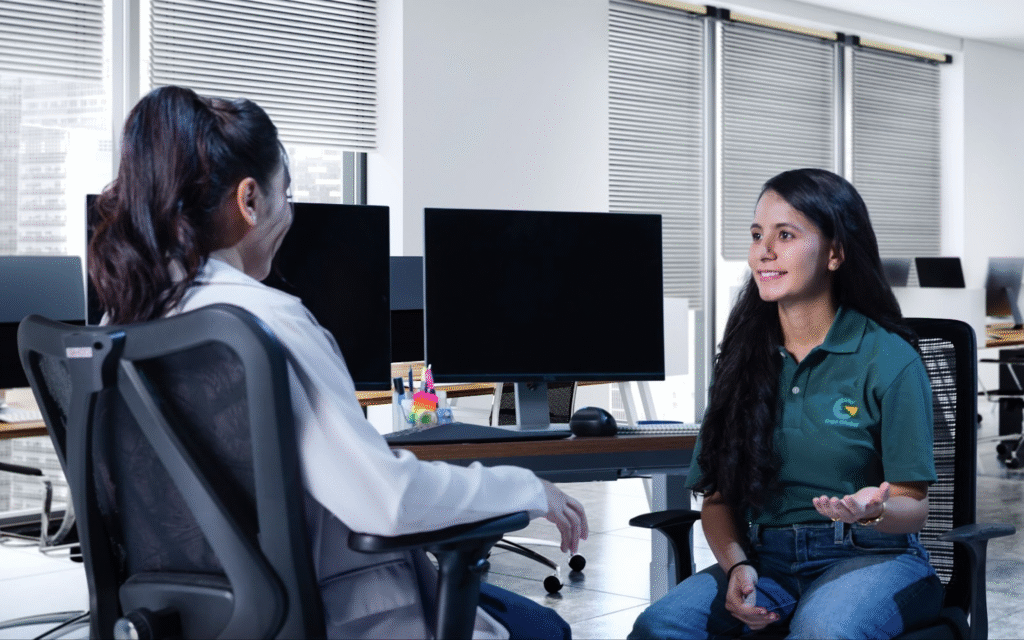 A professional receiving guidance as part of the best ergonomic assessment certification.