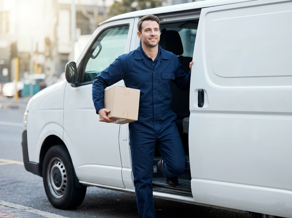 Efficient delivery driver efficiently exiting delivery van.