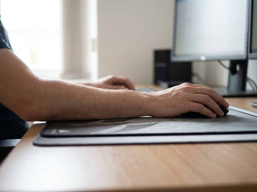 Side view of full forearm resting on desk.Â